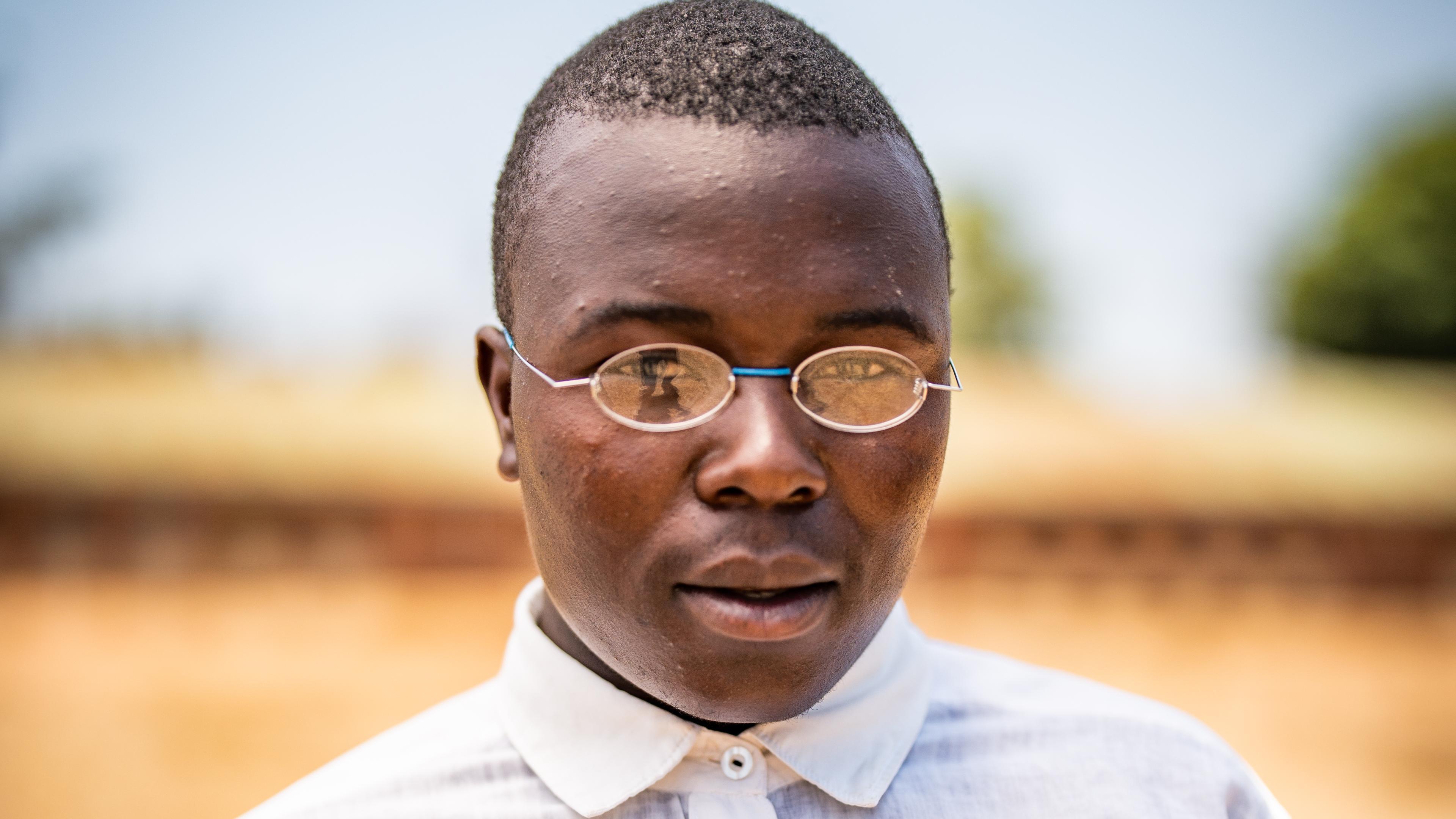 Malawian boy with glasses and shirt